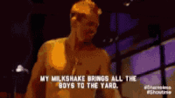 a man without a shirt is talking about his milkshake which brings all the boys to the yard