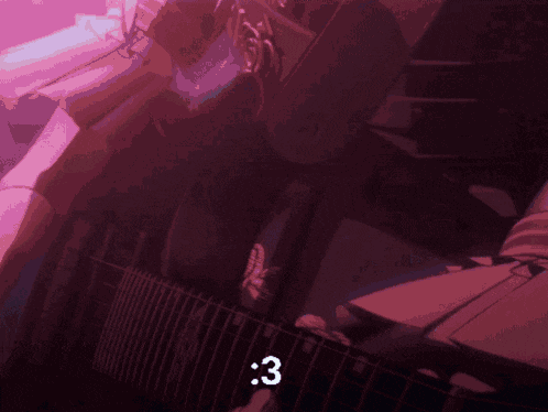 a person playing a guitar with the number 3 visible