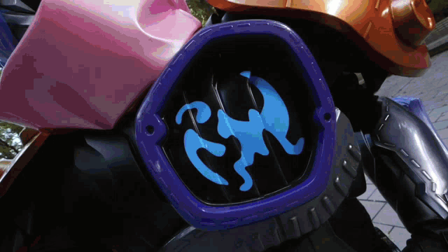 a close up of a blue and purple item with a monkey on it