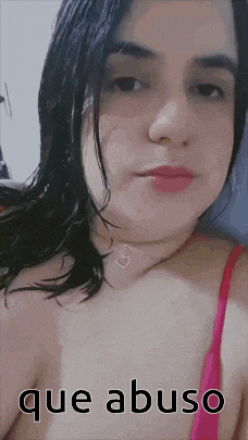a woman is wearing a pink bra and has the word abuso on her chest