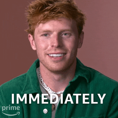 a man in a green shirt says immediately in white letters
