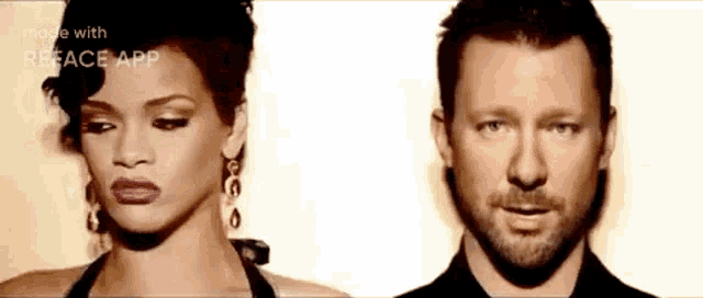 a man and a woman are standing next to each other and looking at each other .
