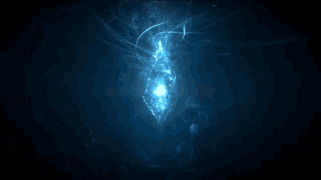 a glowing object in the dark with a blue background