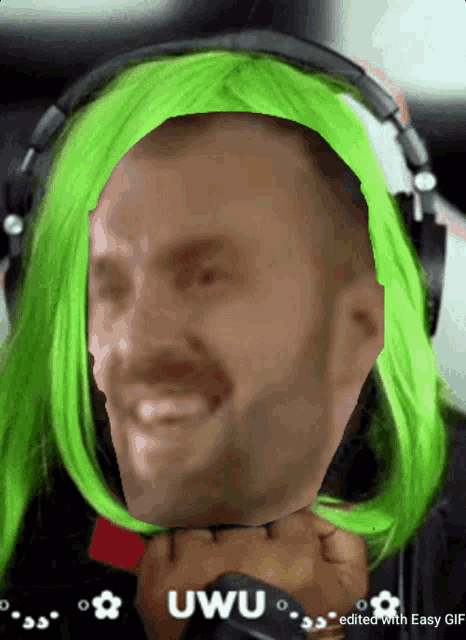 a man wearing headphones and a green wig has the word uwu on the bottom