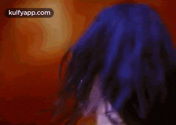 a close up of a woman 's face with the words kulfyapp.com on the bottom right