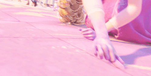 a girl in a purple dress is kneeling down on a sidewalk