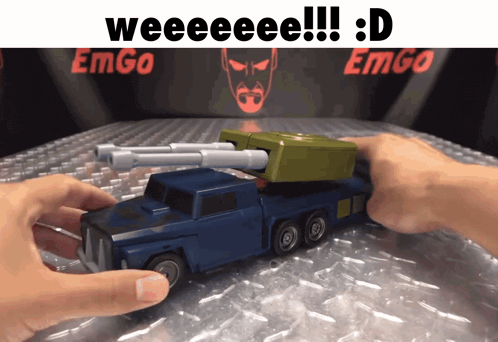 someone is playing with a toy truck that says weeeee !!! : d