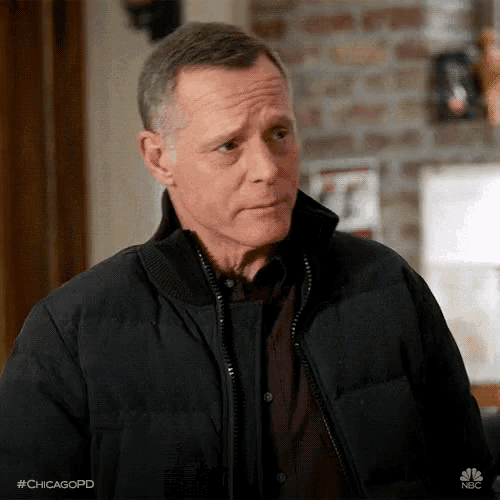 a man wearing a black jacket with the hashtag #chicagopd on it