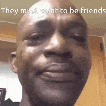 a close up of a man 's face with the words they must want to be friends above it