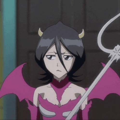 a girl in a devil costume with horns and wings