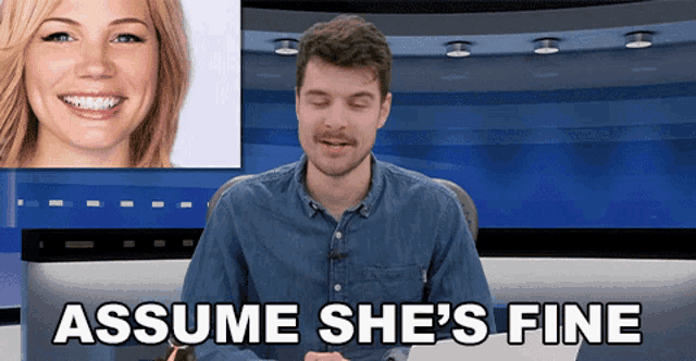 a man with a mustache is sitting in front of a screen that says " assume she 's fine "