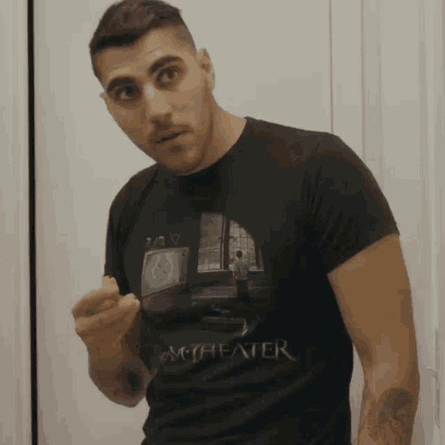 a man wearing a black t-shirt that says myheater