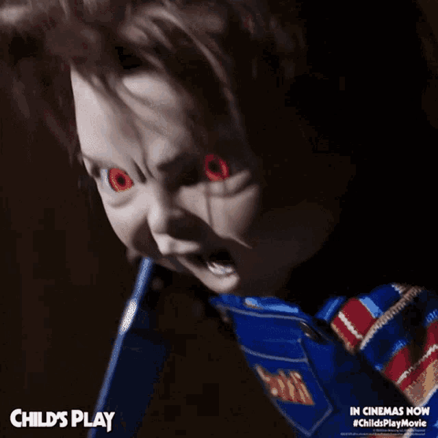 a child 's play doll with red eyes and overalls