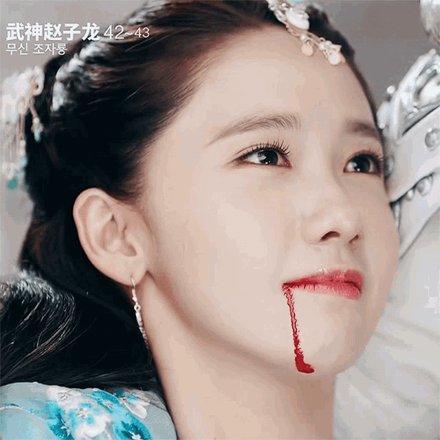 a woman with blood coming out of her mouth