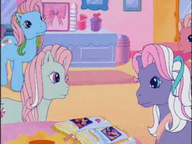 a group of ponies are looking at a book that says " friendship is magic "