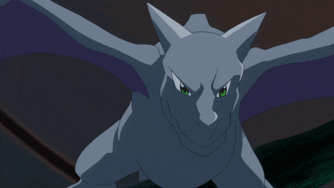 a cartoon dragon with green eyes and wings
