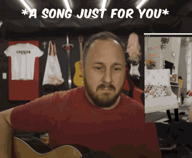 a man in a red shirt is playing a guitar in front of a sign that says a song just for you