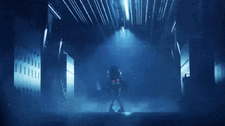 a person is standing in a dark room with a lightning bolt coming out of the ceiling .