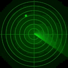 a girl is standing in the middle of a green radar circle .