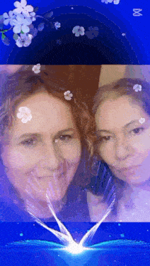 a picture of two women with flowers in their hair and a blue background