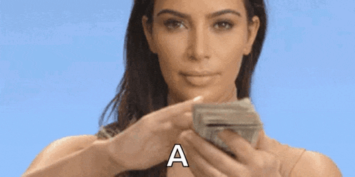 a woman is holding a stack of money in front of her face and says `` a '' .