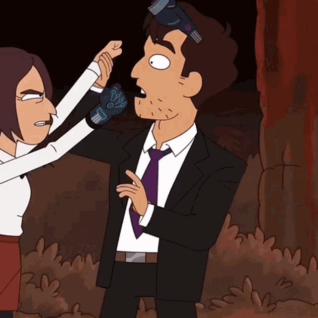 a man in a suit and tie is being held by a woman with a glove that says ' j ' on it