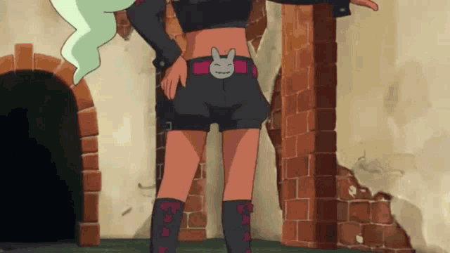 a cartoon character is standing in front of a brick wall