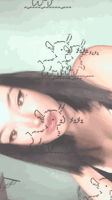 a woman 's face is shown with a drawing of a rabbit on her face