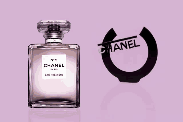 a bottle of chanel no 5 eau premiere perfume on a pink background