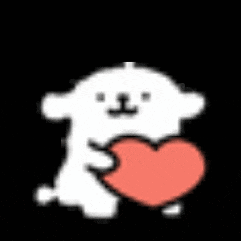 a white dog is holding a red heart in his mouth .