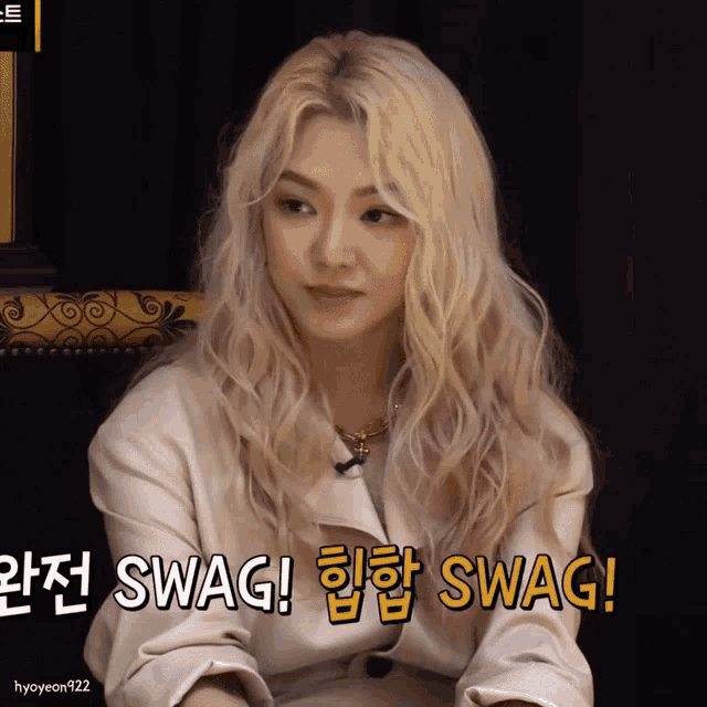 a woman in a white jacket says swag in yellow letters