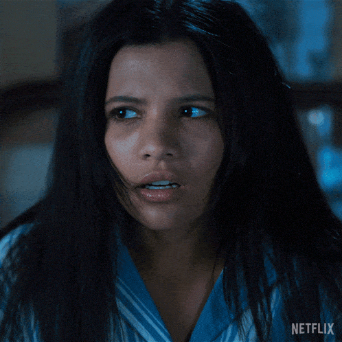 a close up of a woman 's face with the word netflix on the bottom right