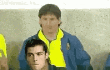 a group of soccer players are standing next to each other .