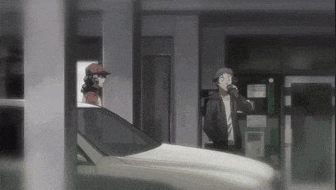 a couple of people standing next to a car in a parking lot