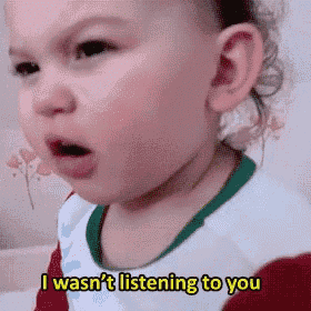a little girl is making a funny face and says i wasn 't listening to you .