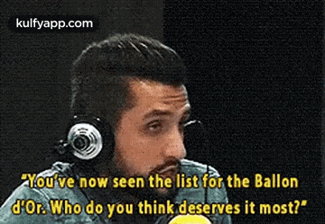 a man wearing headphones is talking into a microphone while talking about the list for the ballon d' or .