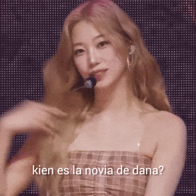 a woman in a plaid dress with the words " kien es la novia de dana " on the bottom
