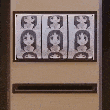 a vending machine with a picture of a girl on the screen .