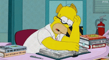 homer simpson sits at a desk with a stack of books including one called the code mistress of death