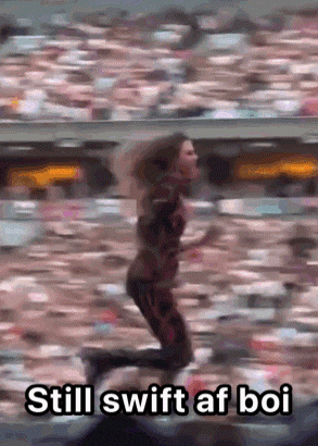 a woman is running in front of a crowd with the words still swift af boi written below her