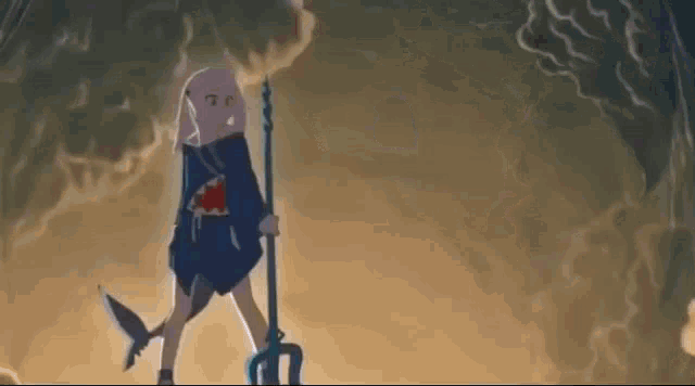a girl with a shark tail is holding a trident and standing in a cave .