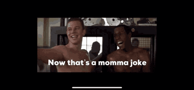 two shirtless men are laughing with the words now that 's a momma joke on the bottom