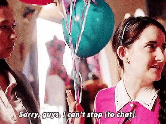 a girl in a pink shirt says sorry guys i can 't stop it to chat