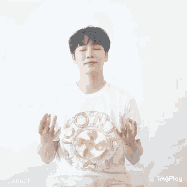 a man wearing a white t-shirt with a picture of a rabbit on it