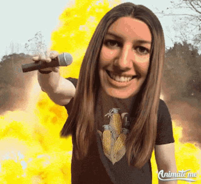 animate me shows a woman holding a microphone in front of a fire