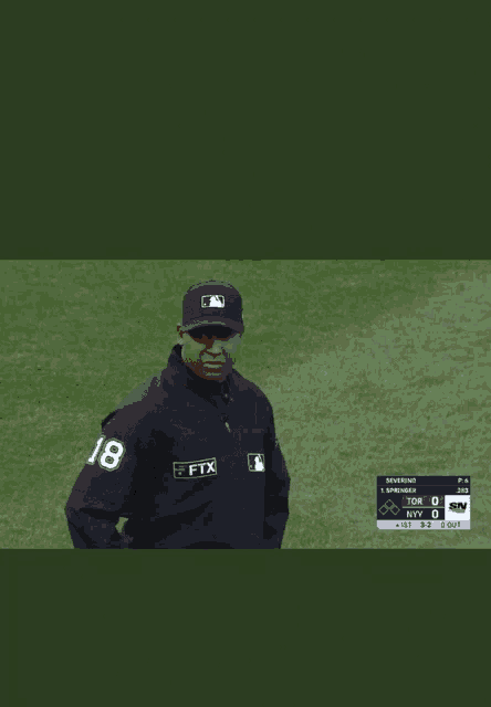 a baseball referee wearing a black jacket with the number 8 on the front