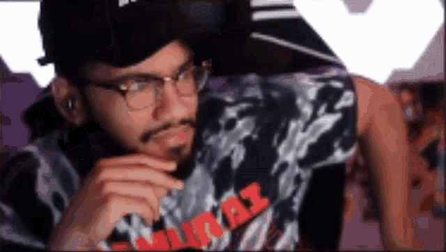 a man wearing glasses and a t-shirt that says samurai