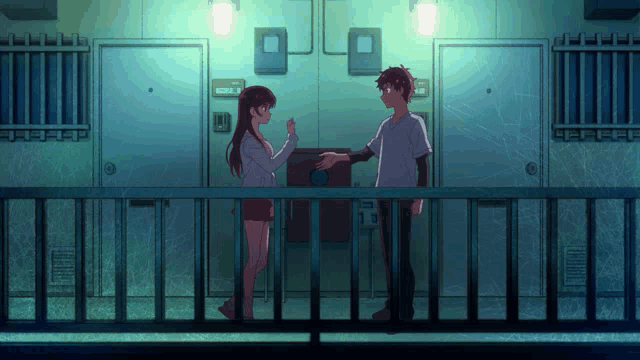 a boy and a girl are shaking hands on a balcony in front of a building