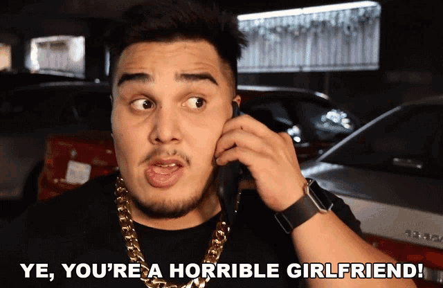 a man talking on a cell phone with the words ye you 're a horrible girlfriend written below him