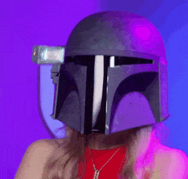 a woman wearing a helmet with a flashlight attached to it